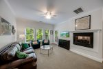 Living room with fireplace & TV